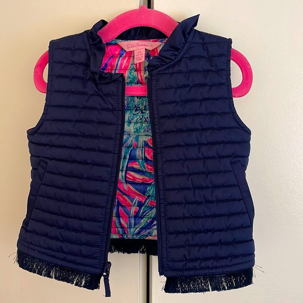 Lilly Pulitzer navy vest with fringe bottom and signature lilly print lining 2/3
